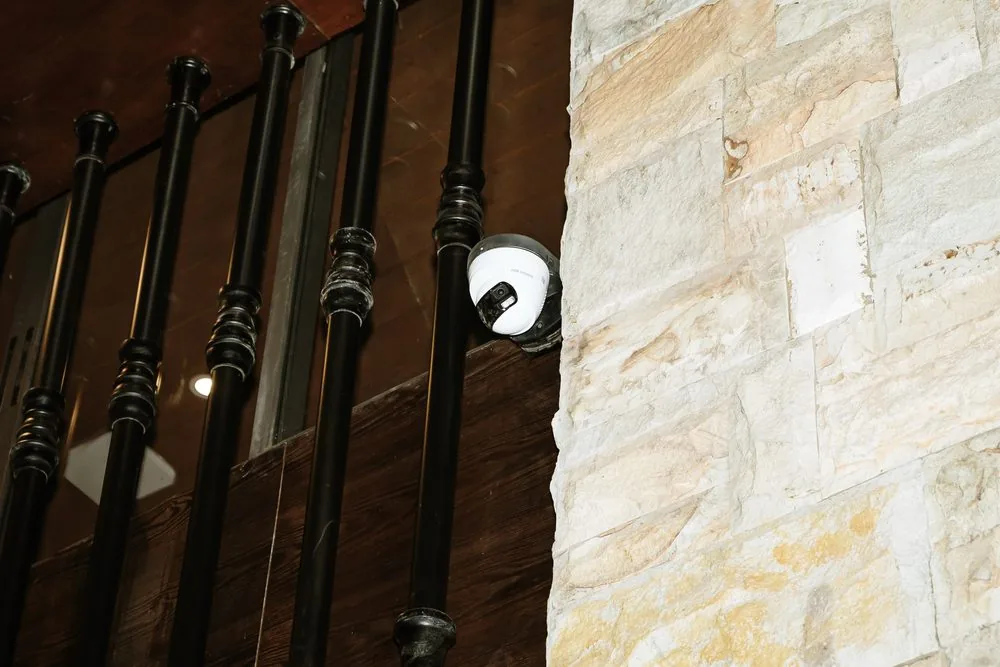 Dome CCTV cameras on a stair railing