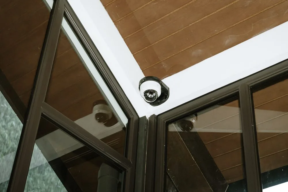 CCTV camera on a glazed roof frame