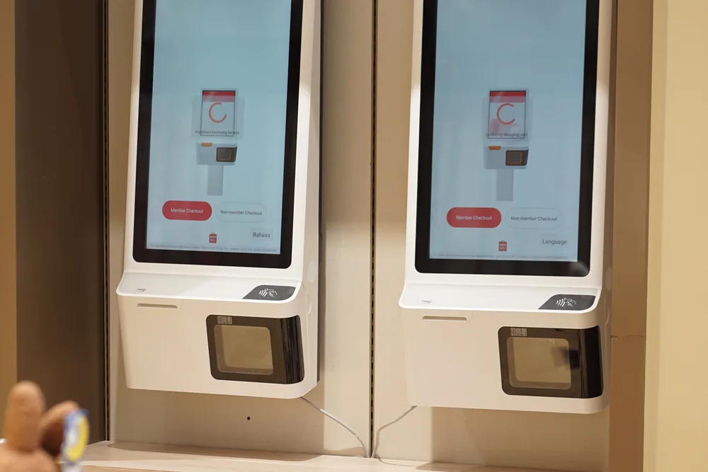 Two self-service payment machines wired to the LAN in the store