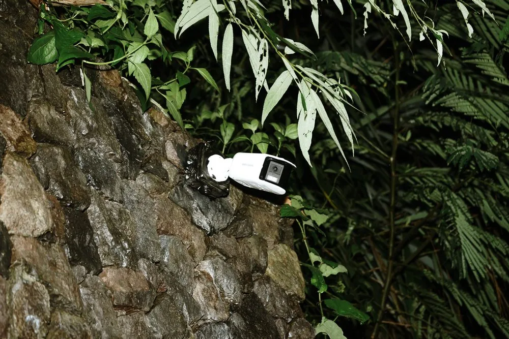 Outdoor CCTV camera on a stone wall